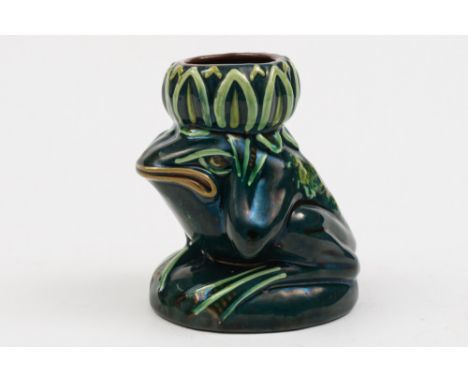 An Aller Vale (Torquay) pottery grotesque spill vase: in the form of a frog supporting a lily upon it's head, decorated with 