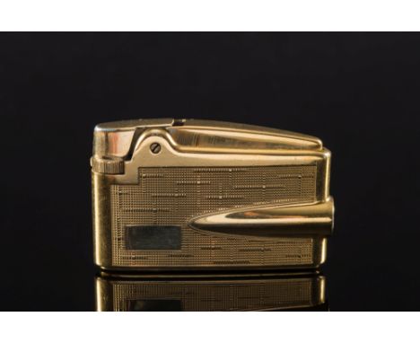 Ronson, a 9ct gold lighter, boxed: the case with decorated sides and stamped on the underside for Ronson with the marks 9, .3