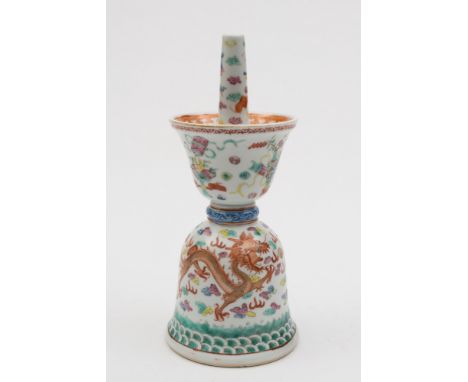 A Chinese famille rose altar candlestick: painted with auspicious objects and fruit, the lower body with two iron red dragons