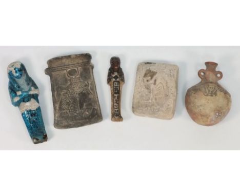 An Egyptian late dynasty clay tablet: together with a blue glazed faience ushapti, a clay example, a pottery flask and a clay