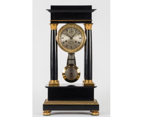 Gounouilhou et Francois a Geneve, an ebonised portico clock:, the eight-day duration movement striking the hours and half-hou