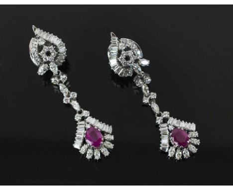 1960'S RUBY AND DIAMOND EARRINGS, the pendant set with a single oval ruby each weighing approx 1.80 carats within a baguette 