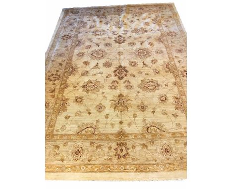 ZIEGLER STYLE CARPET, of vines and palmettes in ruby and gold on ivory field.