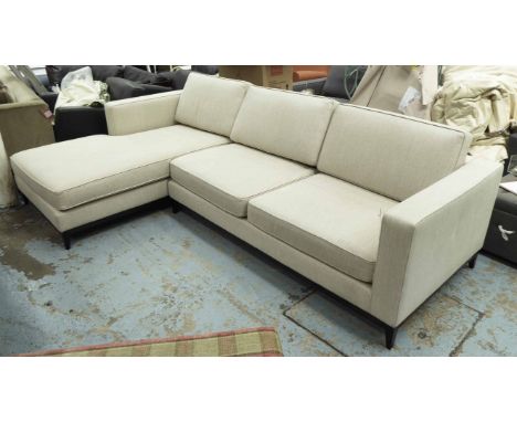 CORNER SOFA, in an ivory fabric on ebonised frame, 288cm x 181cm.