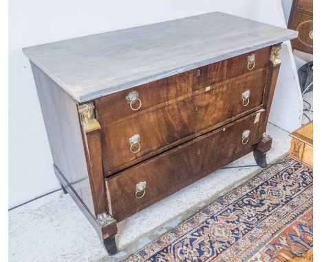 COMMODE, Empire mahogany the grey marble top over three drawers flanked by gilt bronze Egyptian figural detail. (with faults)