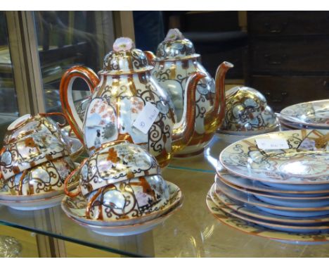 A Fine Japanese Egg Shell Satsuma Tea Set, comprising tea pot, six tea cups and saucers, one cake plate and six sandwich plat