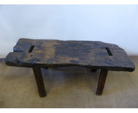 An Elm 18th Century 'Pig Bench', approx 100 x 35 x 43 cms, on splayed legs.