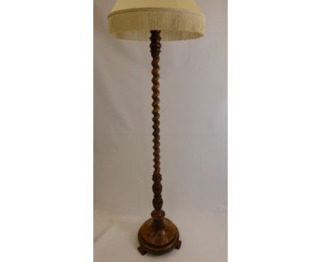 A Barley Twist Walnut Veneer Standard Lamp Base, approx 150 cms high with decorative cream covered lamp shade.