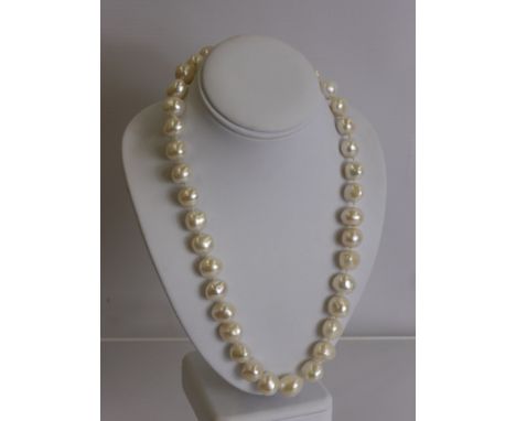 A Set of Large Cultured Baroque Pearls, 37 pearls, the necklace having 18 ct gold pearl form clasp, pearls approx 34 mm, appr