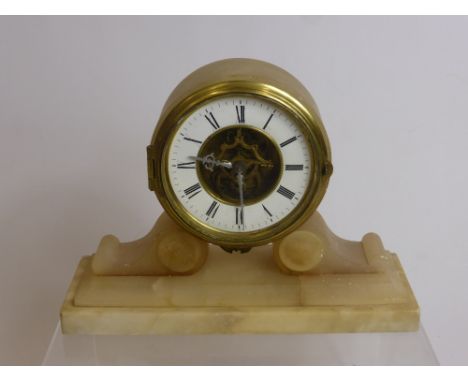 An Antique Alabaster Classical French Mantle Clock, the clock having Roman numerals with skeleton dial.