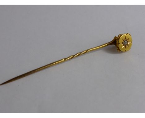 A Gentleman's 15ct Yellow Gold and Diamond Tie Pin.