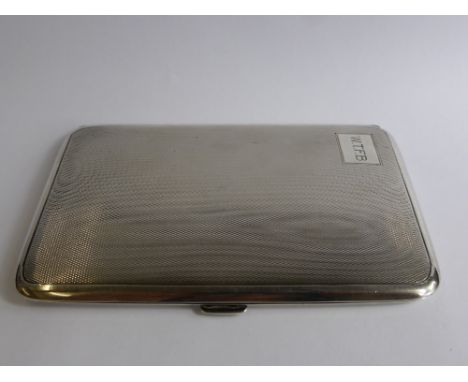 A Solid Silver Cigarette Case, the engine turned case London hallmarked, dd 1935,  mm T W L, approx wt 180 gms.