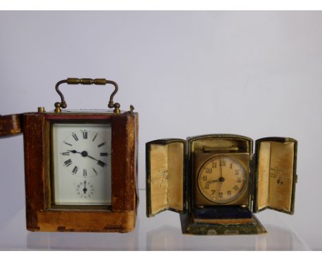 An Antique French Brass Travelling Carriage Clock, the mechanism stamped SFRA in the original leather case together with a tr