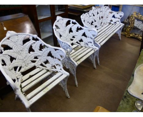 A White Painted Wrought Iron Set of Garden Furniture, in manner of Coalbrookedale. The bench and two chairs having the fern a