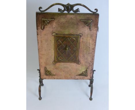 An Arts & Crafts Style Fire Screen in hammered copper and brass, approx 68 x 36 cms.