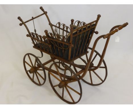 A Victorian Wicker Dolls Pram, with velvet button back and seat, approx 95 x 48 cms