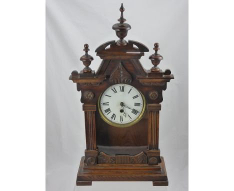 An Oak Cased Wall Clock, with white enamel face and Roman dial, with double mercury pendulum, approx 29 x 55 cms