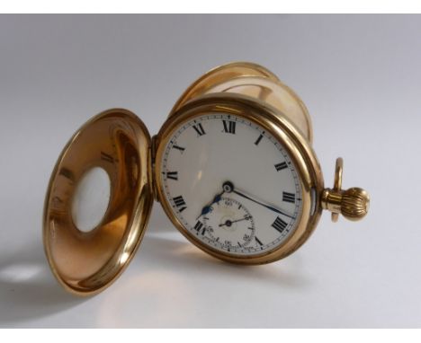 A Gentleman's Keyless 9 Ct Gold and Blue Enamel Half Hunter Pocket Watch, the watch having white enamel face with Roman numer