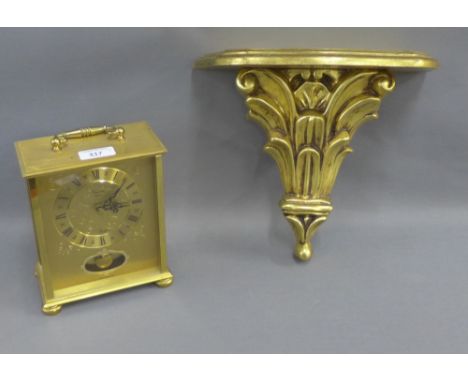 Faux gilt wood wall bracket and a West German brass mantle clock, (2) 