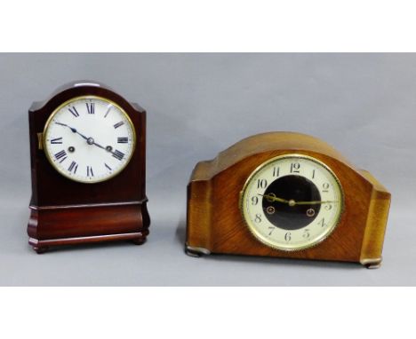 Mahogany cased mantle clock with a domed top over an enamel dial with Roman numerals on four bun feet, 28cm high, together wi