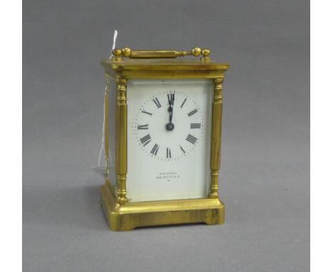 Small brass carriage clock, the enamel dial with Roman numerals and inscribed W.E. Gray, 522 Oxford Street, with leather oute