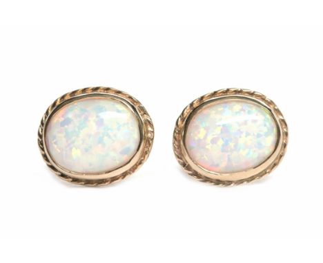 PAIR OF OPAL STUD EARRINGS
each set with a single oval opal approximately 9.7mm ling, in nine carat gold