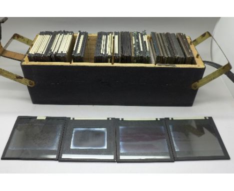 A collection of magic lantern slides, approximately seventy in total
