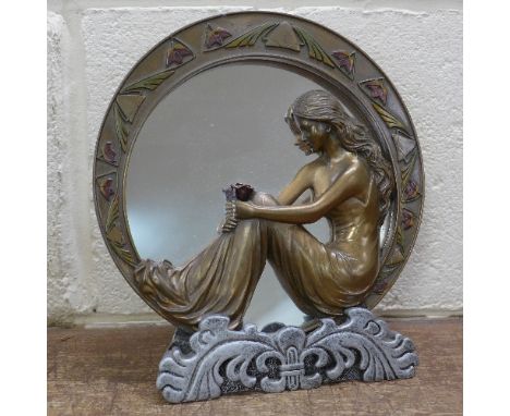 An Art Nouveau style mirror and stand