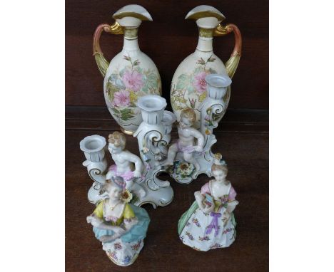 A pair of German figural candlesticks, two French porcelain figures and a pair of Austrian ivory floral decorated vases