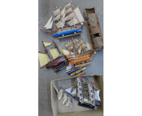 Model boats and a bamboo carving