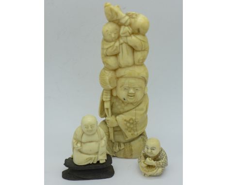 A carved ivory figure, a/f, and two other carvings