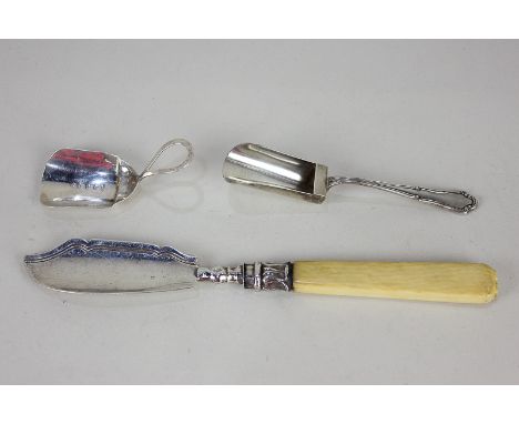 A George III silver tea caddy spoon with loop handle, maker Samuel Pemberton, Birmingham 1904, a continental 800 silver caddy