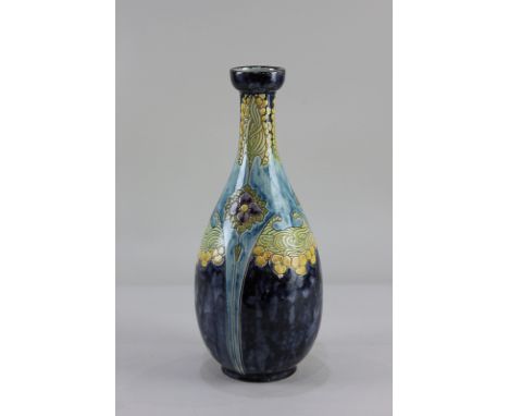 A Della Robbia pottery bottle neck vase, with floral design on purple and blue ground, the base inscribed 18-98 C-AIW (a/f) 3