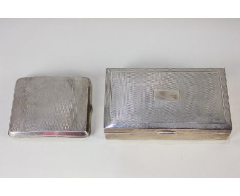 A George VI silver cigarette box, rectangular shape with engine turned decoration, maker Sanders &amp; Mackenzie, Birmingham 