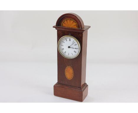 A miniature mahogany cased Smiths longcase clock, inlaid with batwing paterae, the circular white enamel dial with Roman nume