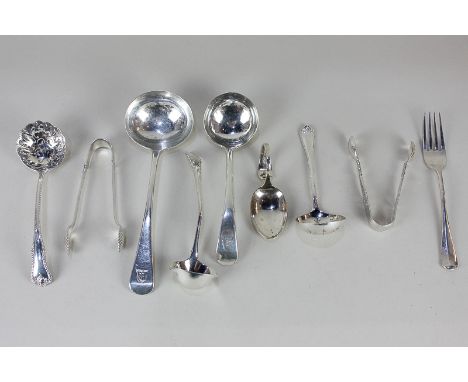 A George III silver Old English pattern sauce ladle, two later silver ladles, two sifter spoons, two pairs of sugar tongs, a 