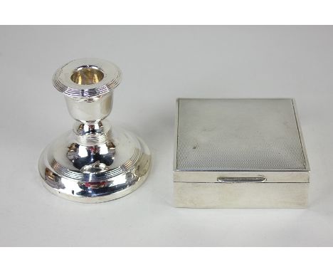 An Edward VII silver dwarf candlestick, on loaded circular base, 8cm high, and a modern silver square cigarette box, 9cm (a/f