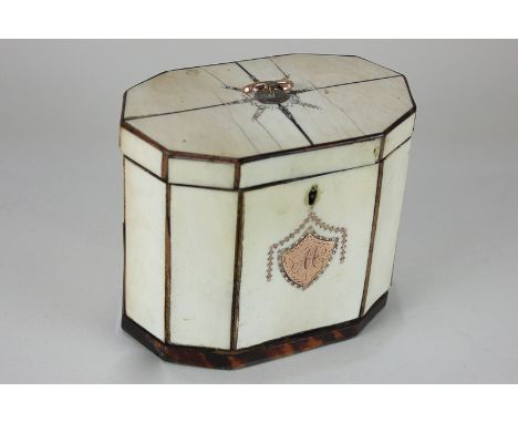 A George III ivory tea caddy, faceted oval form with tortoiseshell edging and base (becoming detached), interior with two lid