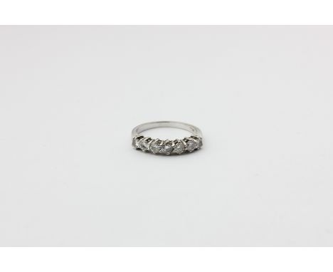 A diamond seven-stone ring, the graduated brilliant cuts on 18ct white gold