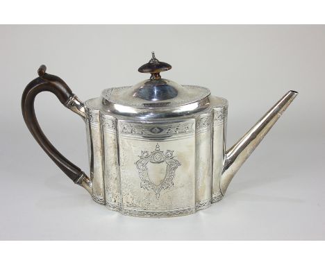 A George III silver teapot, oval serpentine form and straight tapered spout, with engraved borders and vacant cartouches, mak