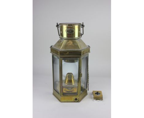 An early 20th century brass mounted ship's lamp with plaque for Bulpitt &amp; Sons Ltd, Birmingham, dated 1928, 40cm high