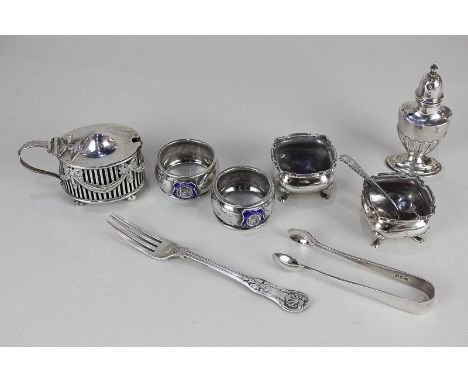 A George V silver oval mustard pot, with pierced and draped ribbon decoration, blue glass liner, Birmingham 1910, a pair of s