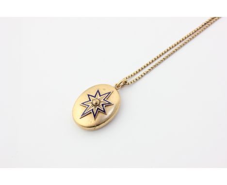A Victorian gilt oval locket on a tubular link chain with bolt ring clasp