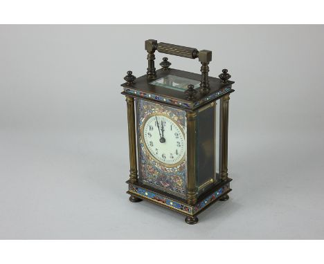 A French brass and cloisonné carriage clock, white enamel dial with Arabic numerals, face with floral decoration and column c