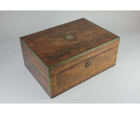 A George IV silver and cut glass travelling dressing table set in brass bound rosewood box, maker possibly Thomas Dicks, Lond