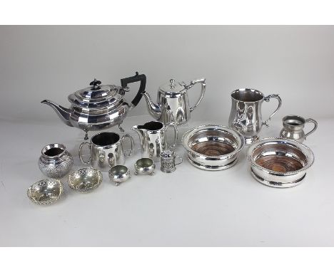 A pair of silver plated bottle coasters, with engraved presentation inscriptions, an oval teapot, small Mappin and Webb teapo