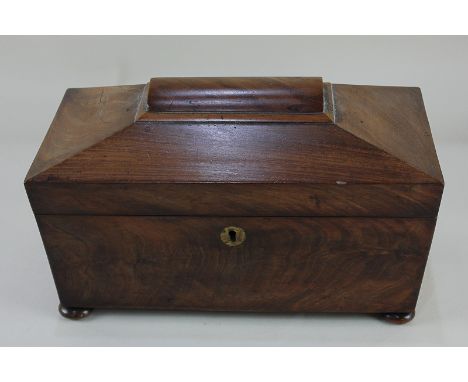 A 19th century sarcophagus shaped tea caddy, fitted with two lidded compartments, and associated glass bowl, on bun feet, 31.