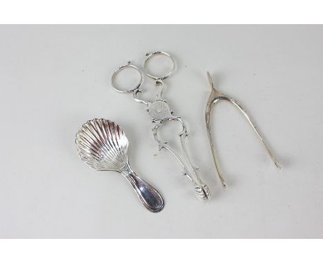 A pair of George III silver sugar snips with shell shaped bowls, engraved initials, indistinct hallmarks, a pair of sterling 