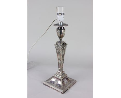 An Adam style silver plated column table lamp in the form of an urn, on tapered plinth and square base, cast with flowers and