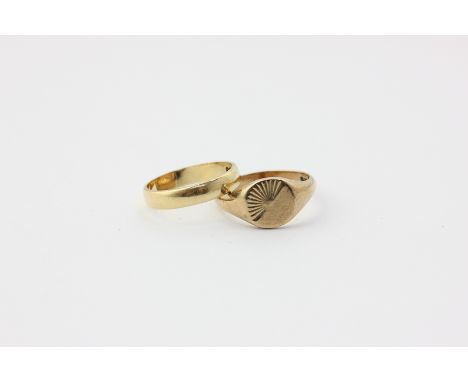 An 18ct wedding ring, 3g, and a 9ct gold signet ring, 3.7g